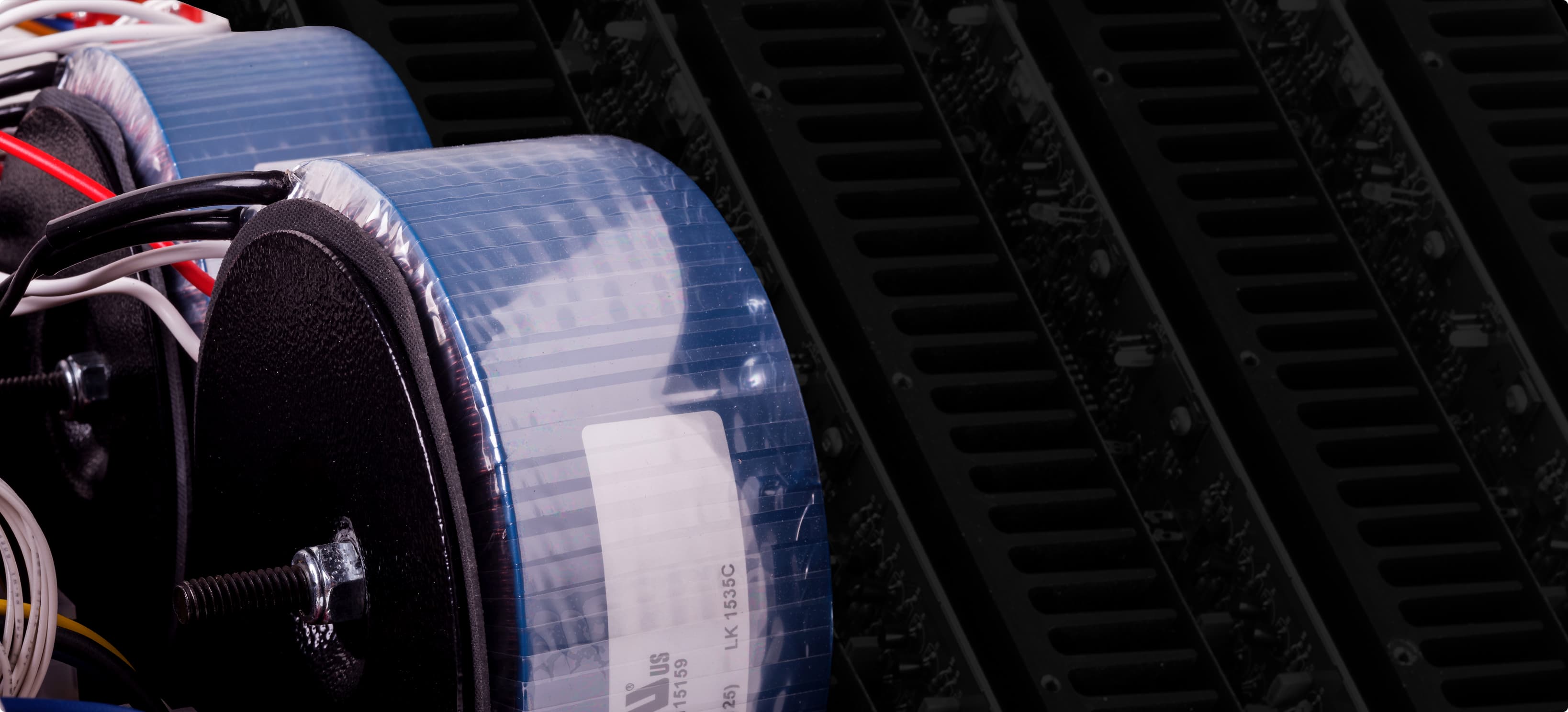 MCA Series amplifier internal view highlighting massive toroidal power supply